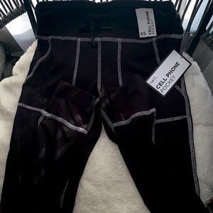 Rue21 yoga pants. Includes: cell phone pocket, drawstrings. Color: Black.